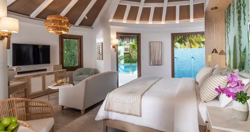 Slaapkamer met zitgedeelte bij Sandals Dunn’s River