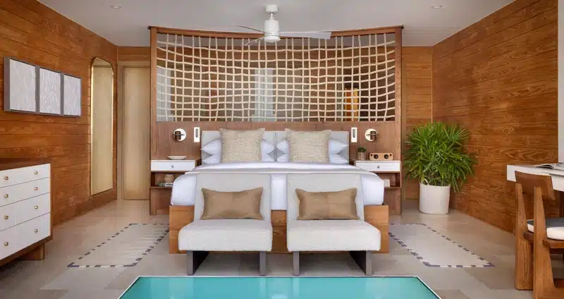 Slaapkamer met houten details in Sandals Saint Vincent